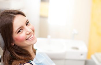 Smiling girl in a dental chair